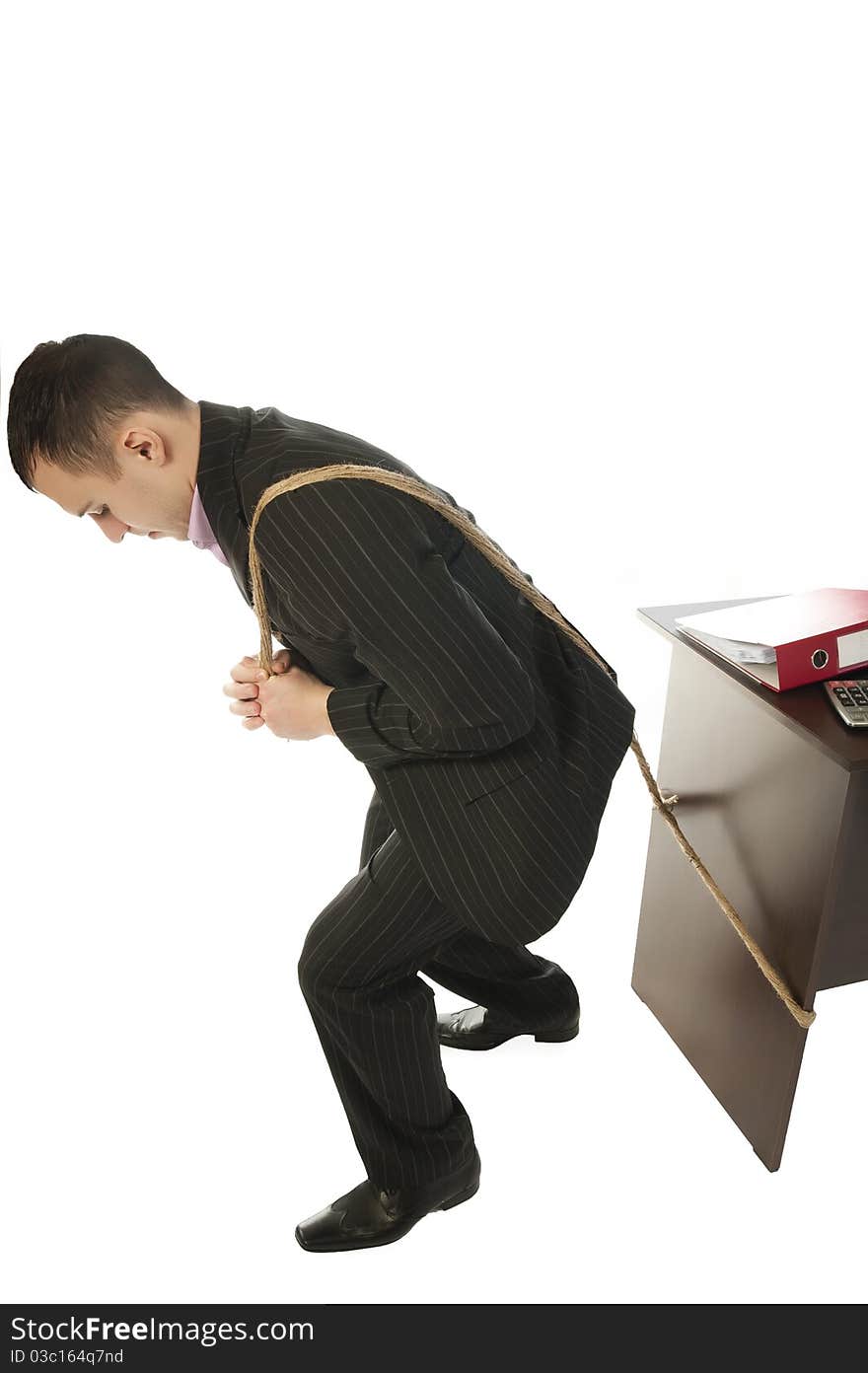 Businessman pulling a desk