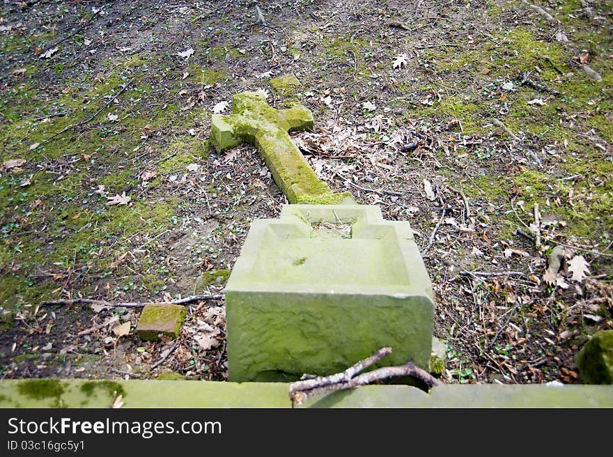 Fallen cross on the cemetery