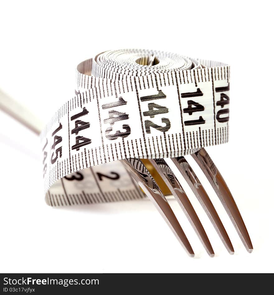 Fork and measuring tape isolated on white background. Fork and measuring tape isolated on white background