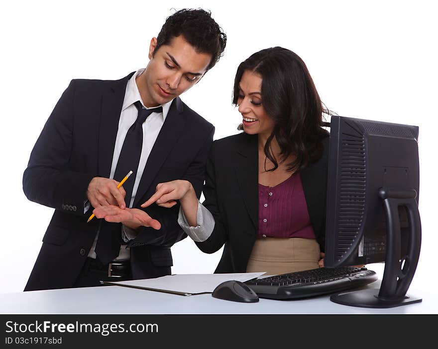 Businesscouple solving a problem near a computer