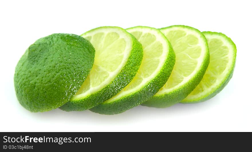 Cut lime close up on white background.