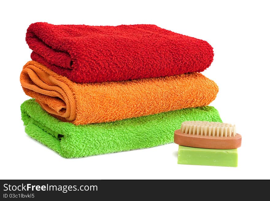 Stacked colorful towels isolated on a white background. Stacked colorful towels isolated on a white background.