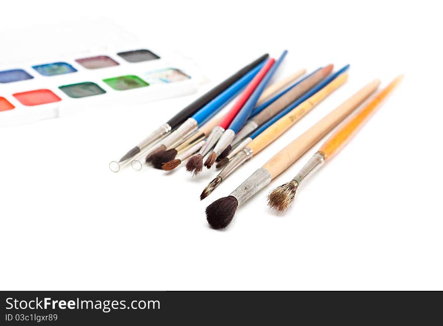 Paint brushes and watercolor isolated on a white background. Paint brushes and watercolor isolated on a white background.