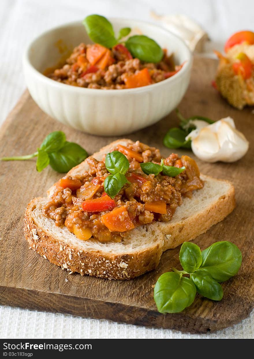 Sandwich of savory ground beef on toasted wholewheat bread. A delicious variety of a Sloppy Joe. Sandwich of savory ground beef on toasted wholewheat bread. A delicious variety of a Sloppy Joe.