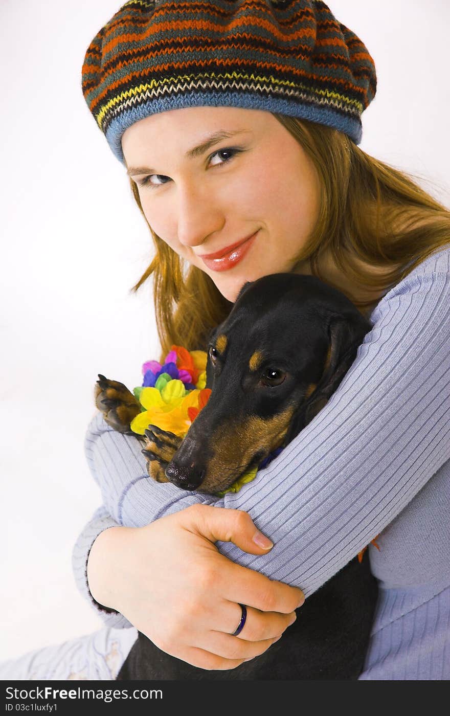 The girl with a dog on hands