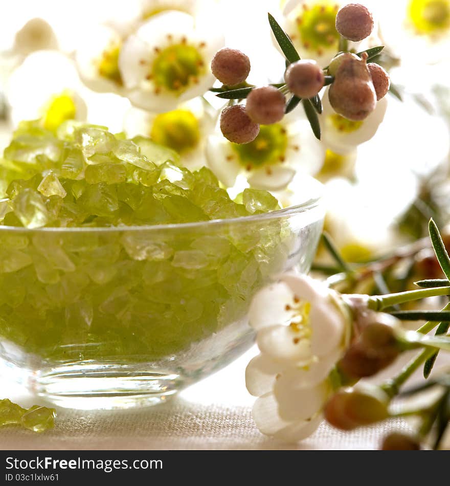 Bath salt in a bowl with flowers. Bath salt in a bowl with flowers