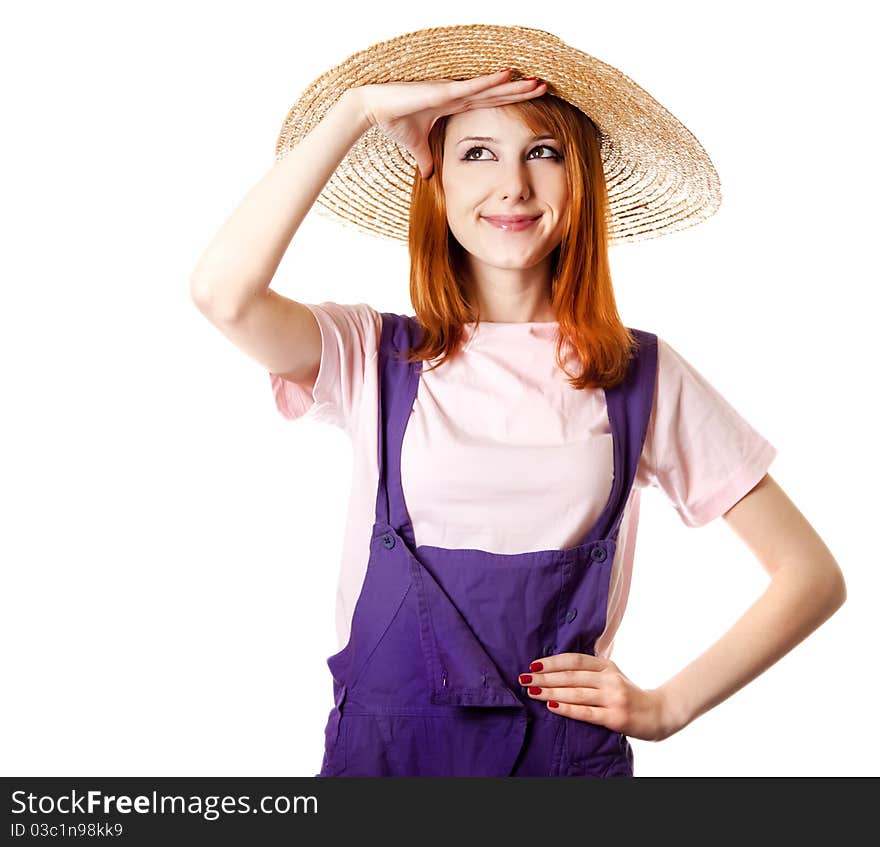 Young girl in overalls.