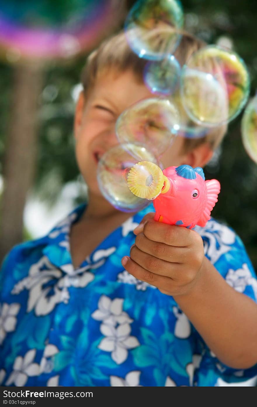 Young Boy Playing With Bubbles