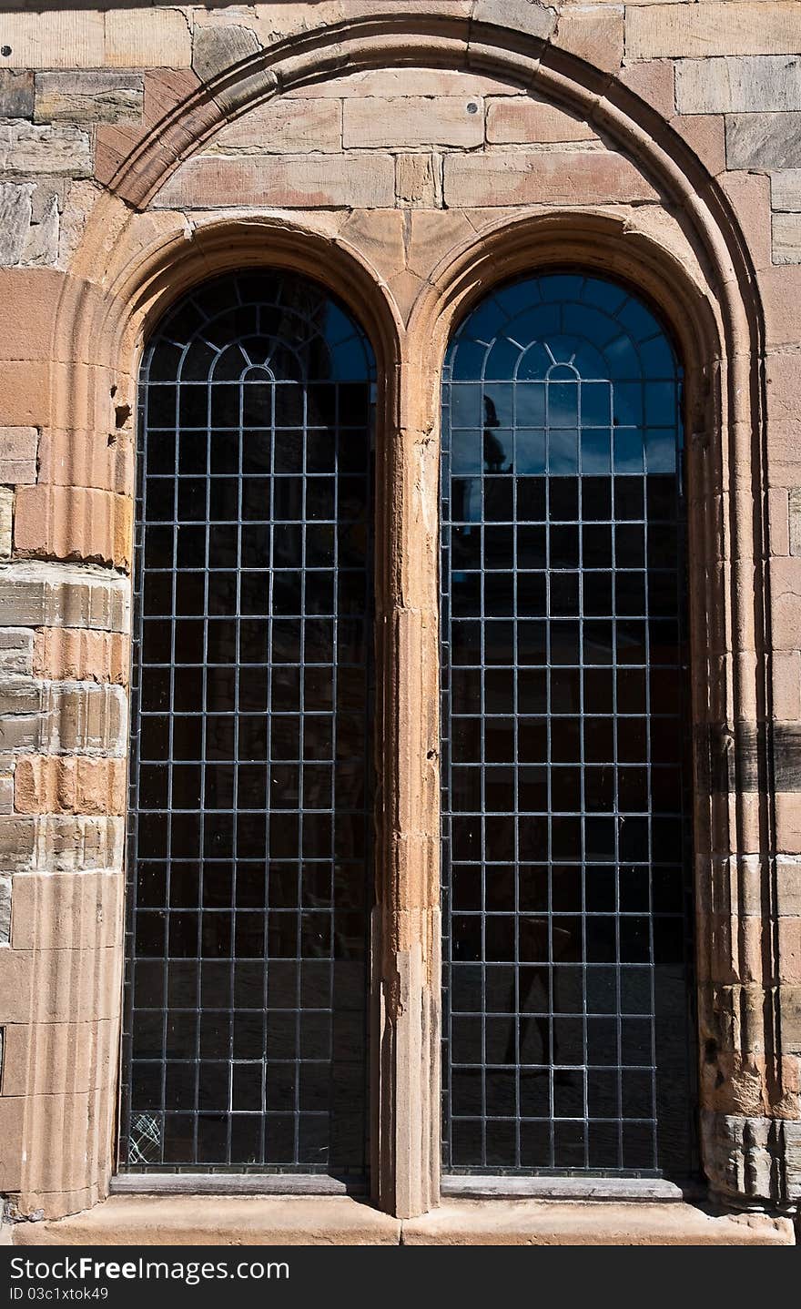 Two tall windows in a castle