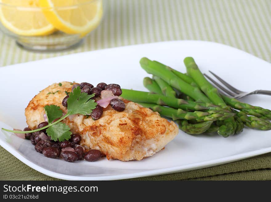 Fish fillet meal with asparagus and lemon slices