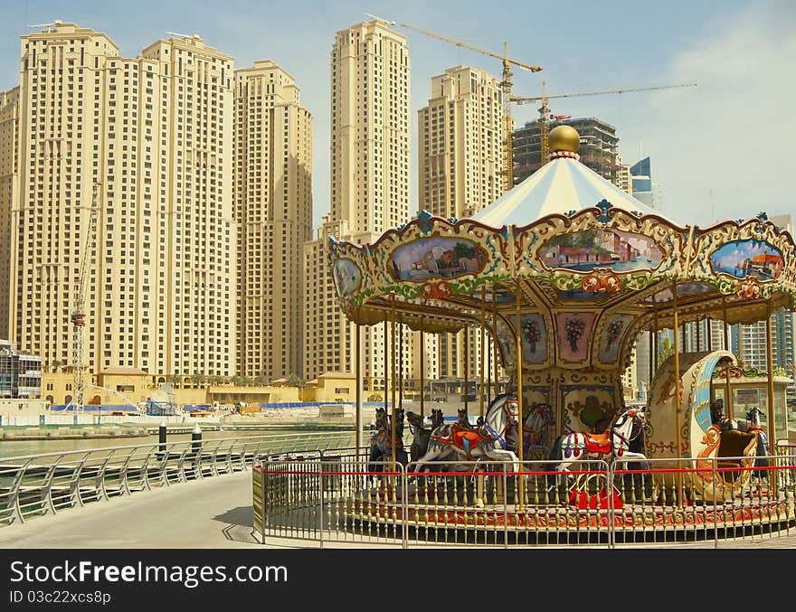 Vintage carousel in the modern city