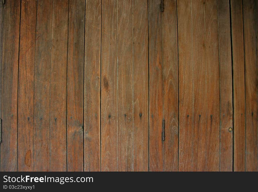 Brown color-wooden wall of the door. Brown color-wooden wall of the door