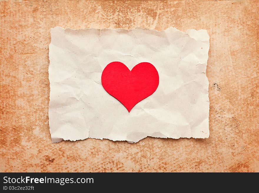 Ripped piece of paper on grunge paper background. vintage retro card. Valentine's Day