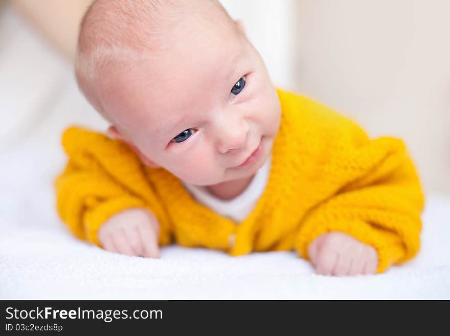 Newborn baby boy in yellow cloth