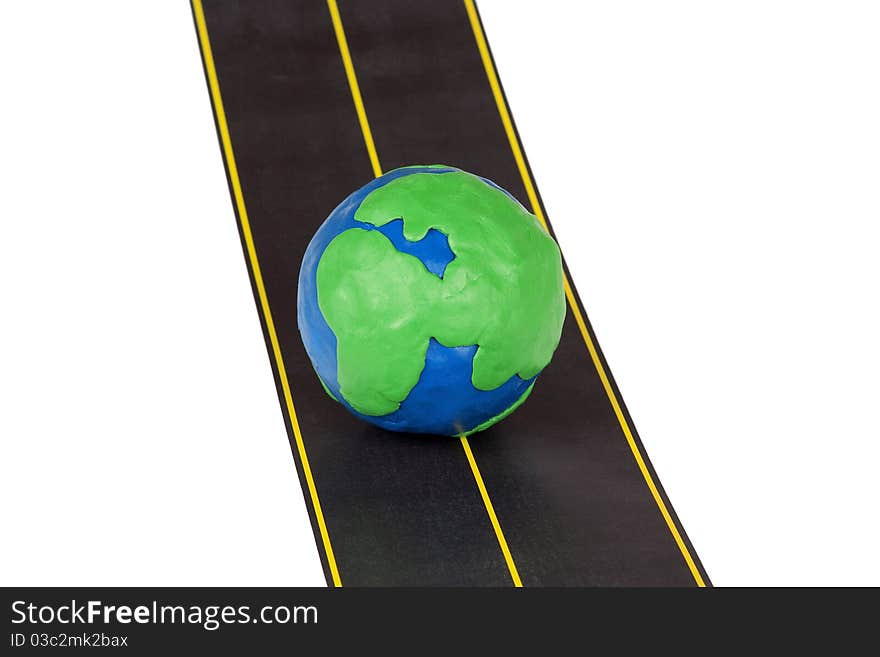 Plasticine model of earth and automobile highway. Plasticine model of earth and automobile highway