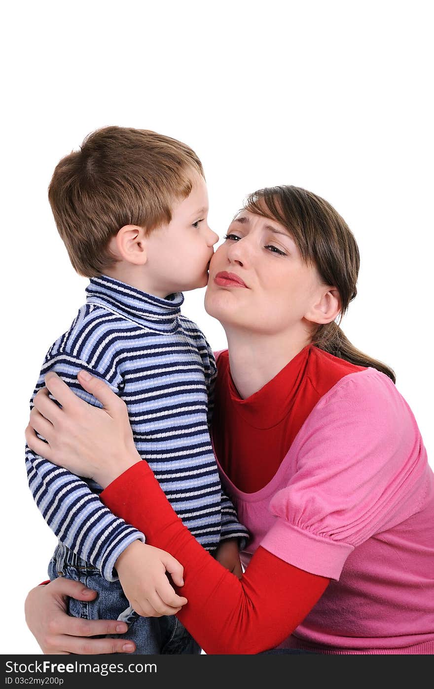 Small son kisses mum. Isolated on white