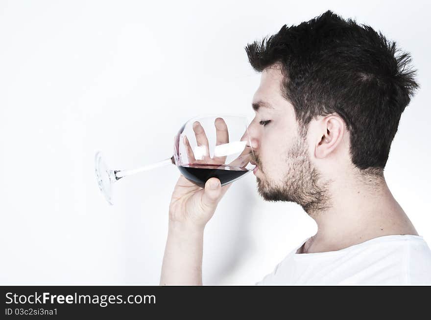 Young man drinking wine