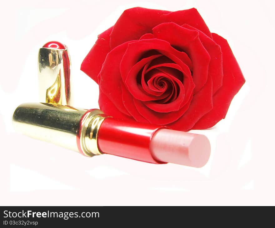 Red lipstick with rose on background