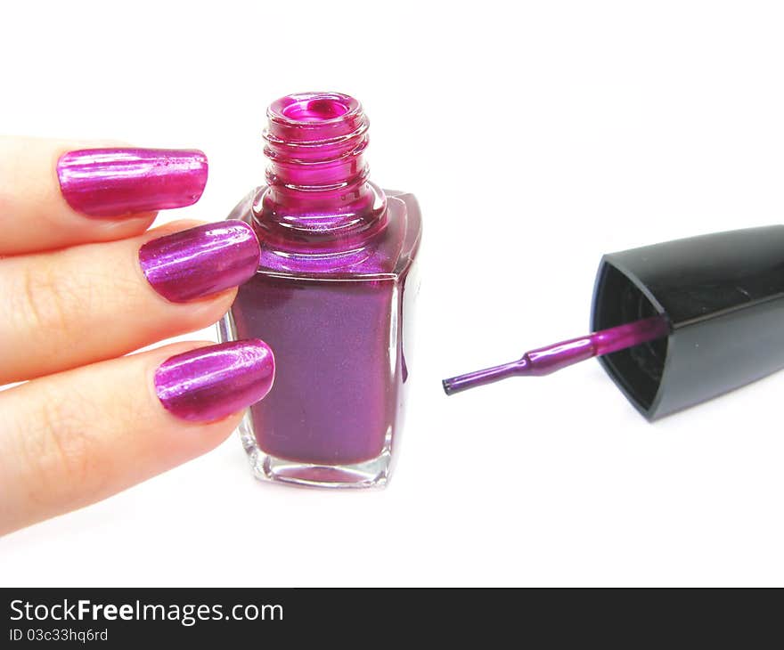 Violet nail polisher doing manicure on hand isolated on white