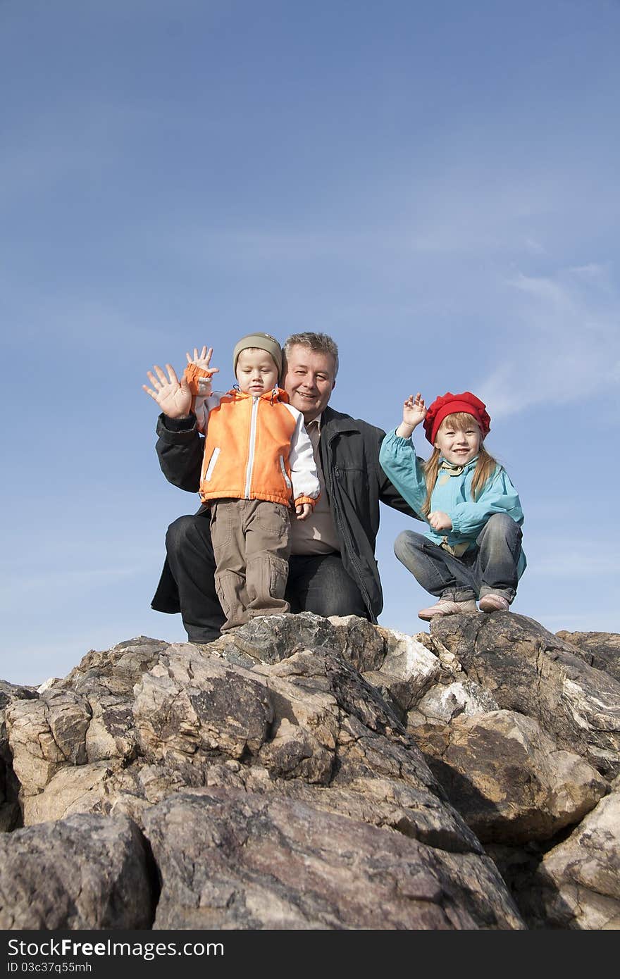 Family have a rest on a grie.