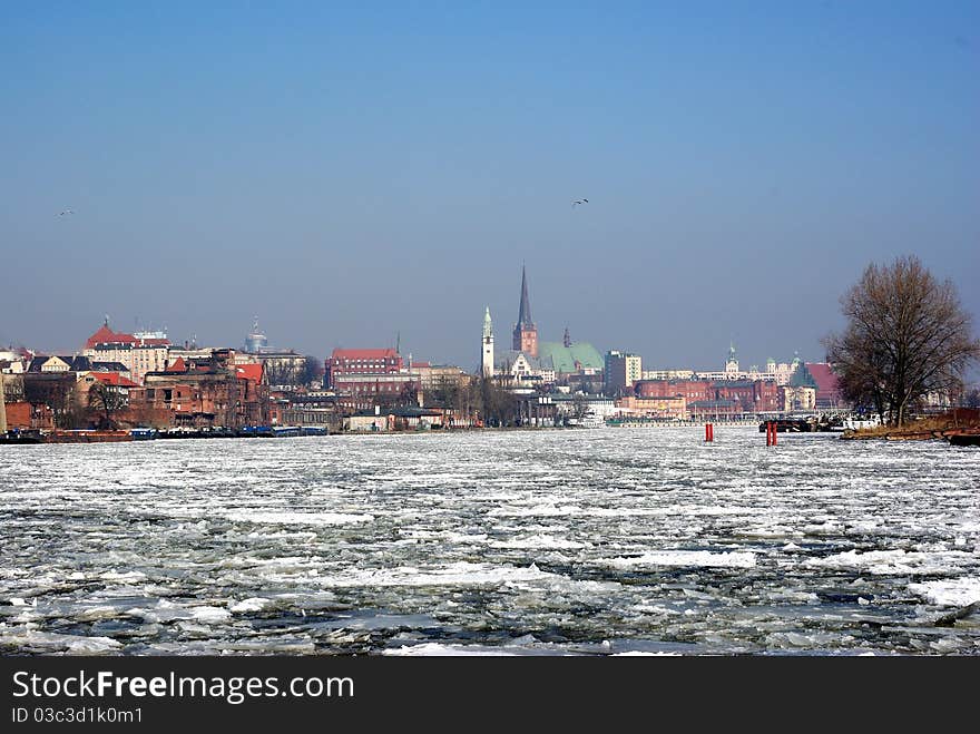 Ice float on river on city background