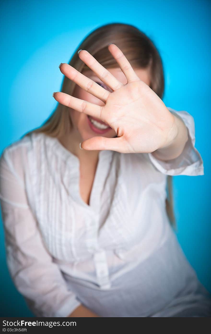 Angry woman on blue background