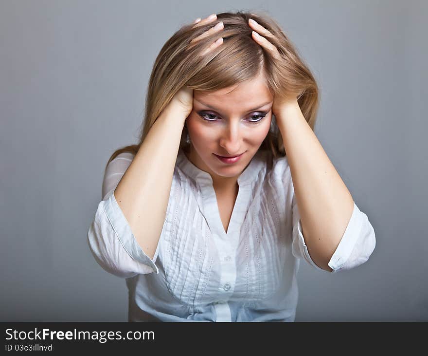 Depressed, sad woman on neutral background. Depressed, sad woman on neutral background