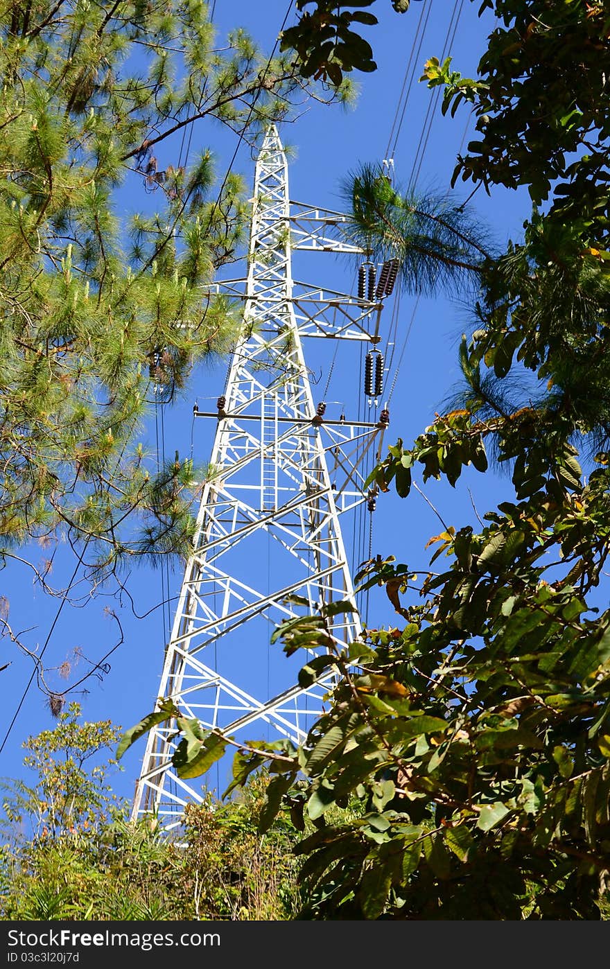 High-voltage towers in the mountains and valleys. High-voltage towers in the mountains and valleys