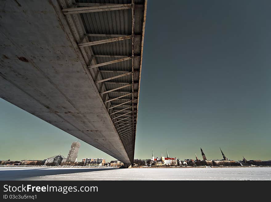 The wide angle view of the bridge over the city.