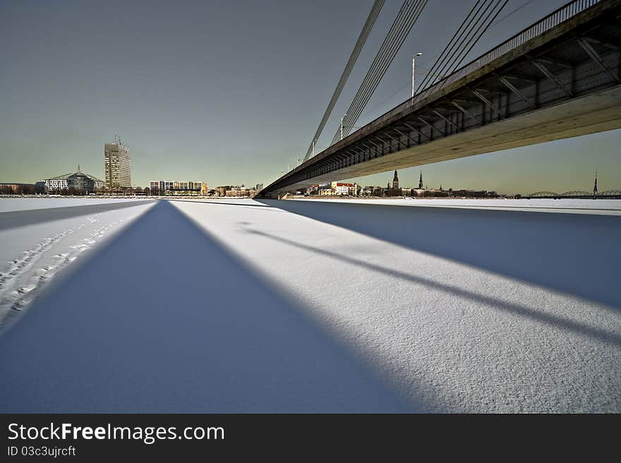 The wide angle view of the bridge over the city.