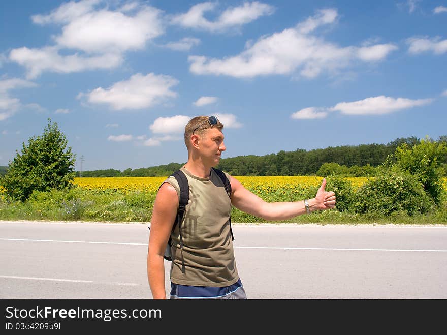 Man stops a cars on a roadside