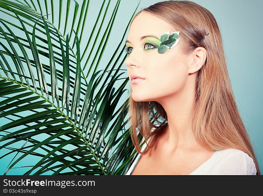 Portrait of a beautiful young woman with spring make-up. Beauty, fashion. Portrait of a beautiful young woman with spring make-up. Beauty, fashion.