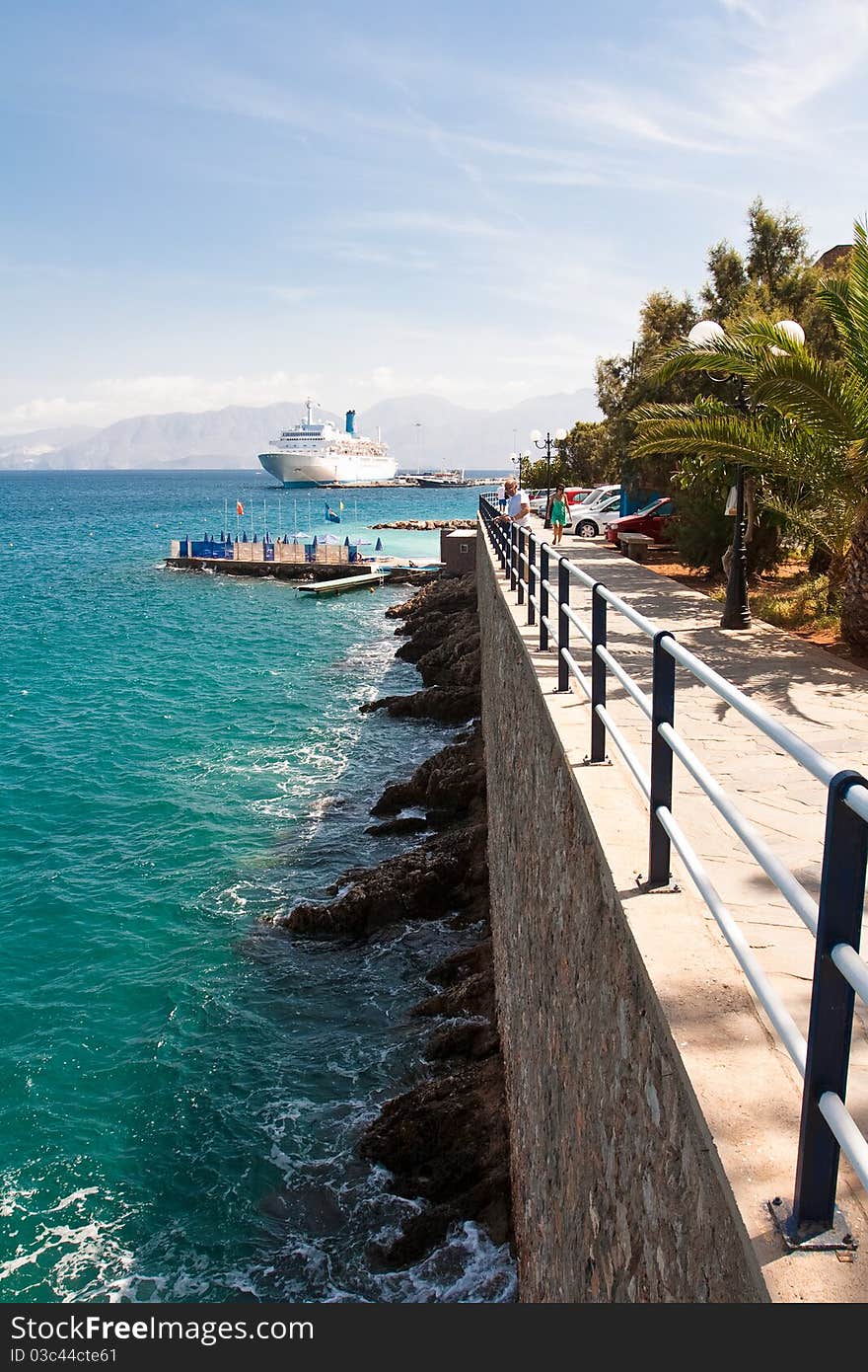 Agios Nicolaos - embankment & ferry at the pier. Agios Nicolaos - embankment & ferry at the pier