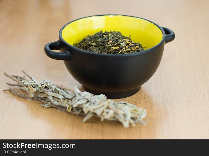 High Quality Green Tea closeup in the yellow bowl