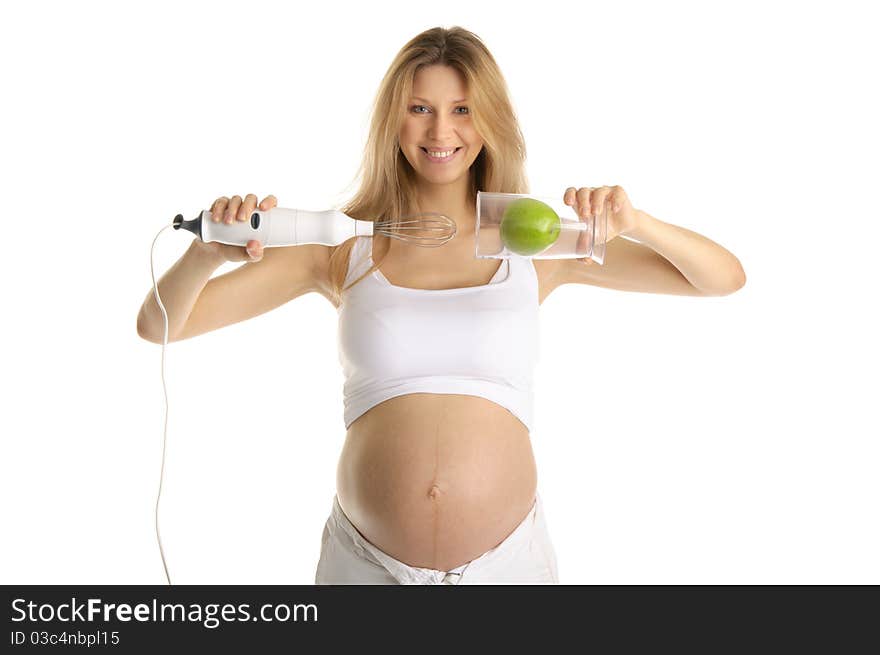 Pregnant woman with a blender and apple isolated on white