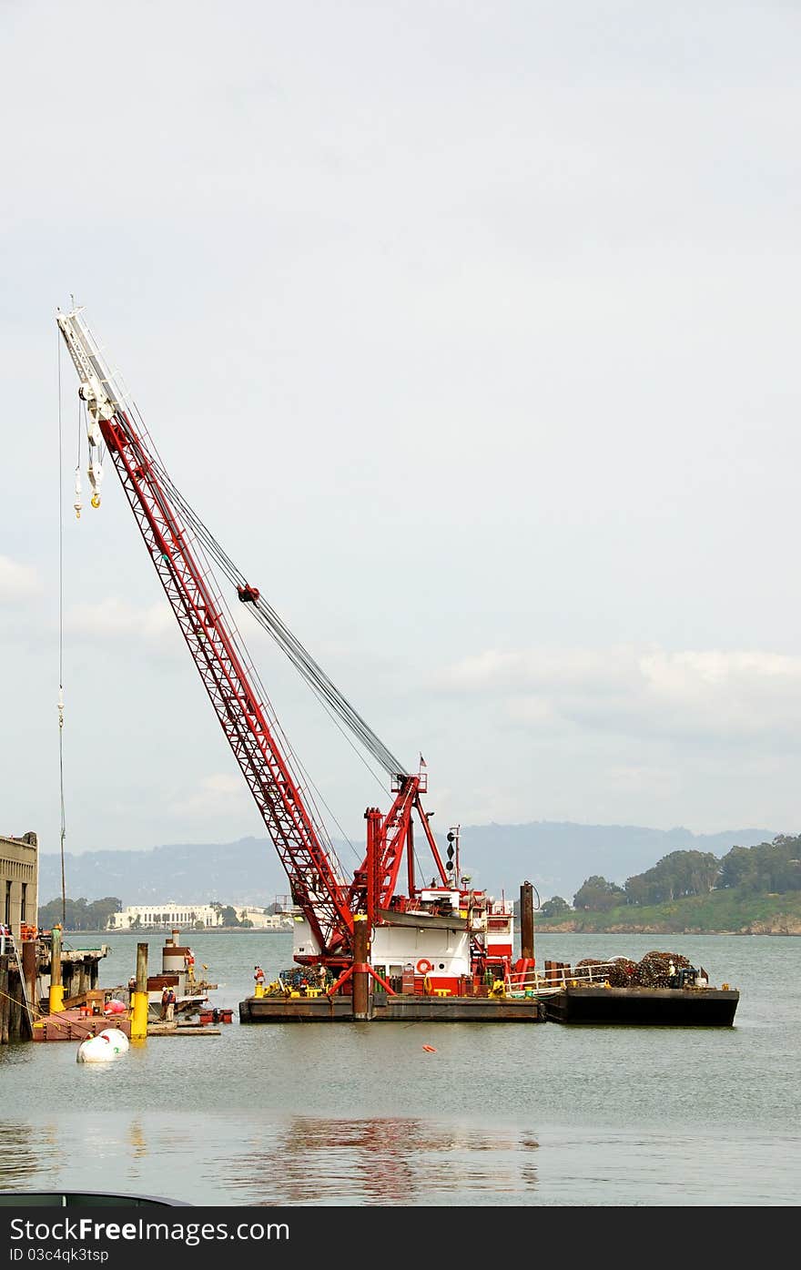 Big red crain on a barge. Big red crain on a barge