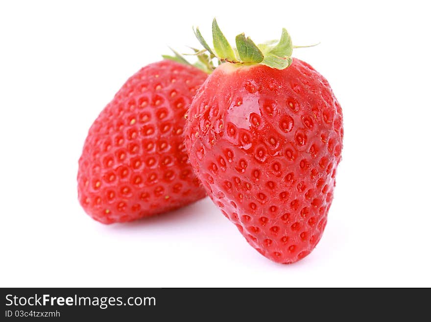 Two fresh strawberries isolated on white background. Two fresh strawberries isolated on white background.