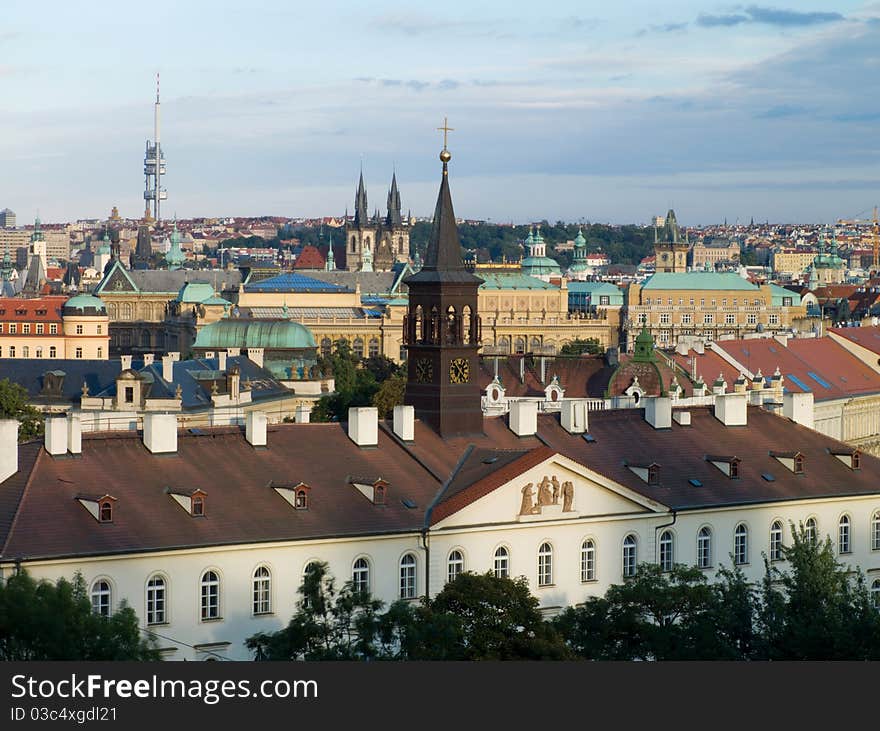 Urban landscape with a steeple in the foreground. Prague, Czech Republic