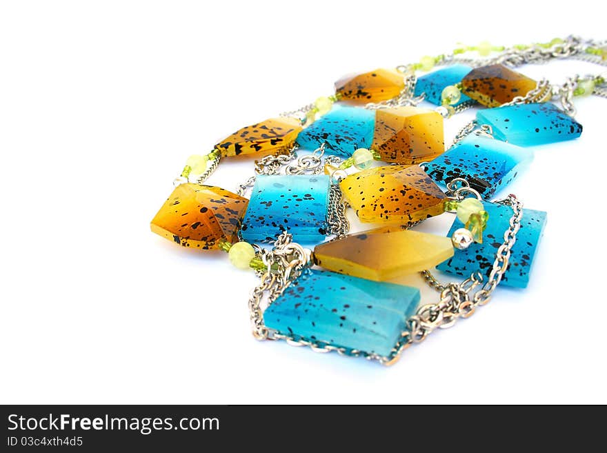 Blue and yellow necklaces isolated on white background.