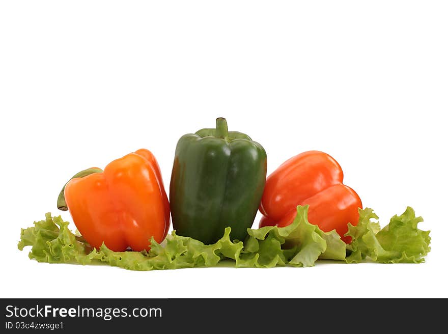 Fresh pepper with lettuce isolated on white. Fresh pepper with lettuce isolated on white