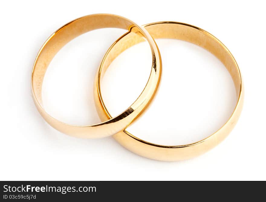 Two gold rings on white background