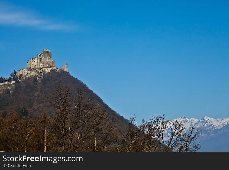 Abbey of 11st century, Piedmont region, Italy. The church, whose construction lasted for many years, is characterized by the unusual position and architecture. Abbey of 11st century, Piedmont region, Italy. The church, whose construction lasted for many years, is characterized by the unusual position and architecture.