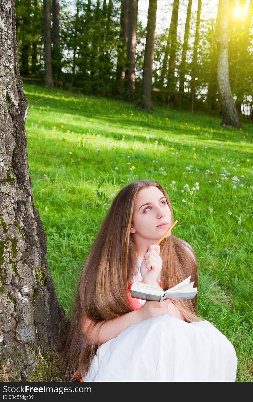 Beautiful Young Girl Writing Outdoor. Beautiful Young Girl Writing Outdoor