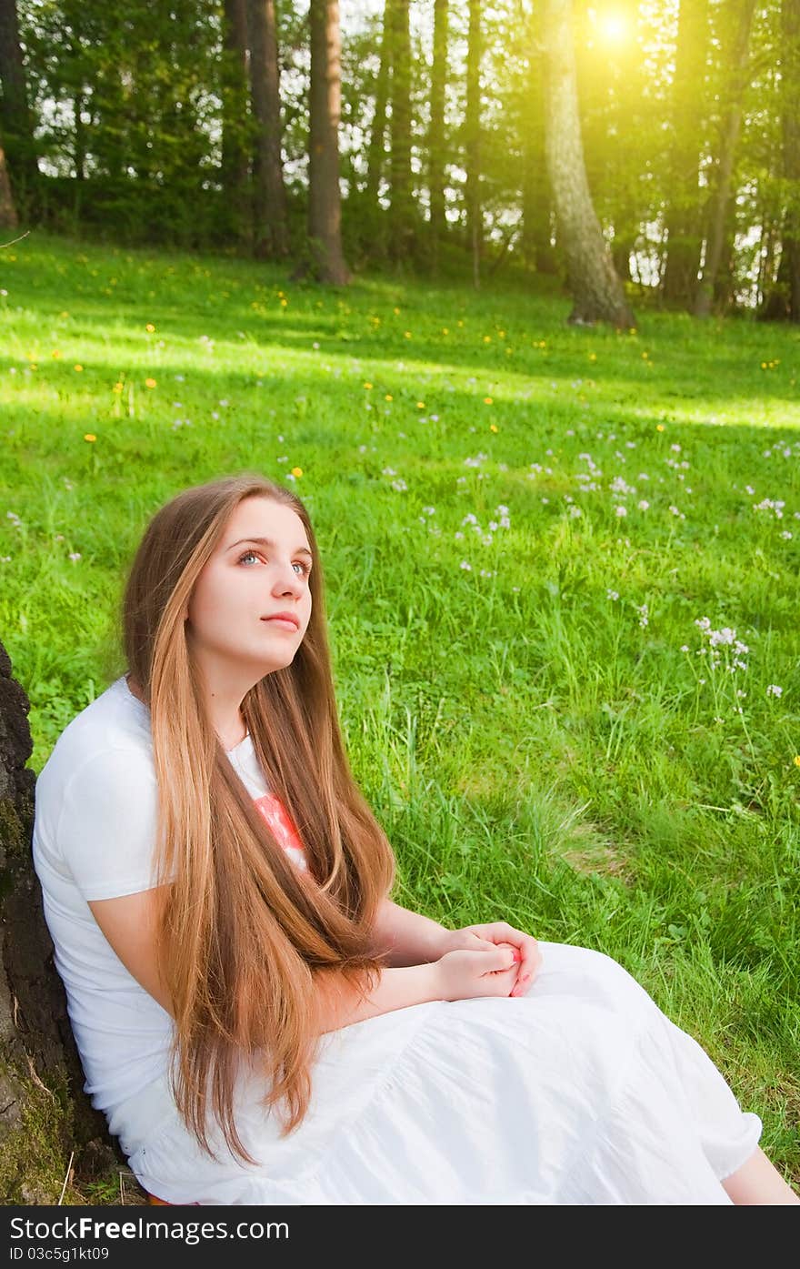 Pretty young girl resting in forest. Pretty young girl resting in forest