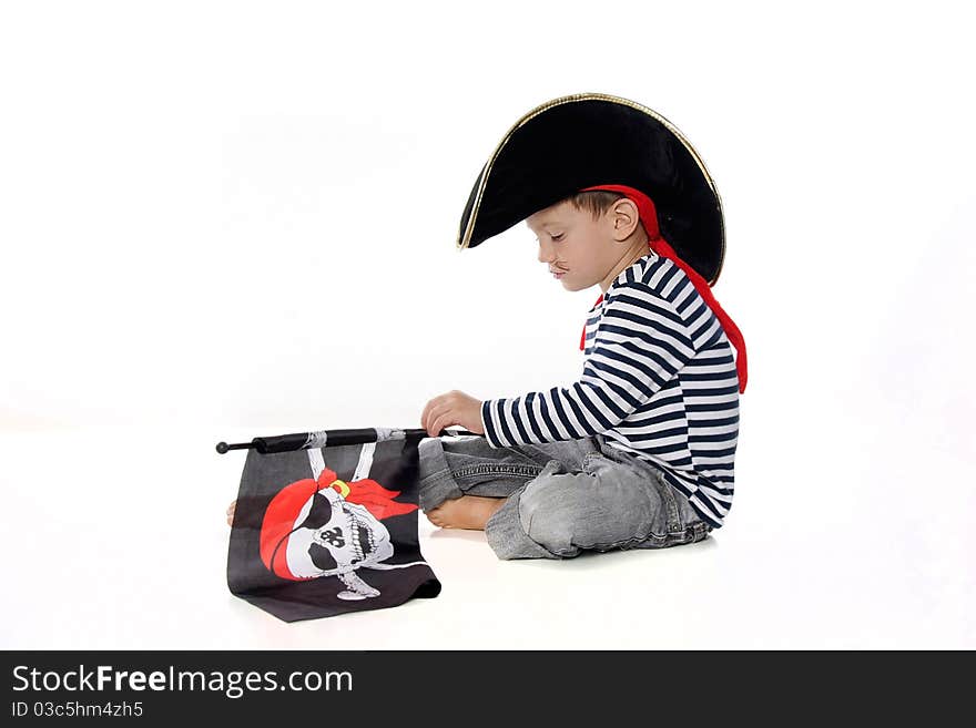 Studio portrait of young boy dressed as pirate