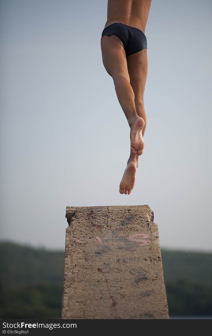 Man Jumping From Diving Platform