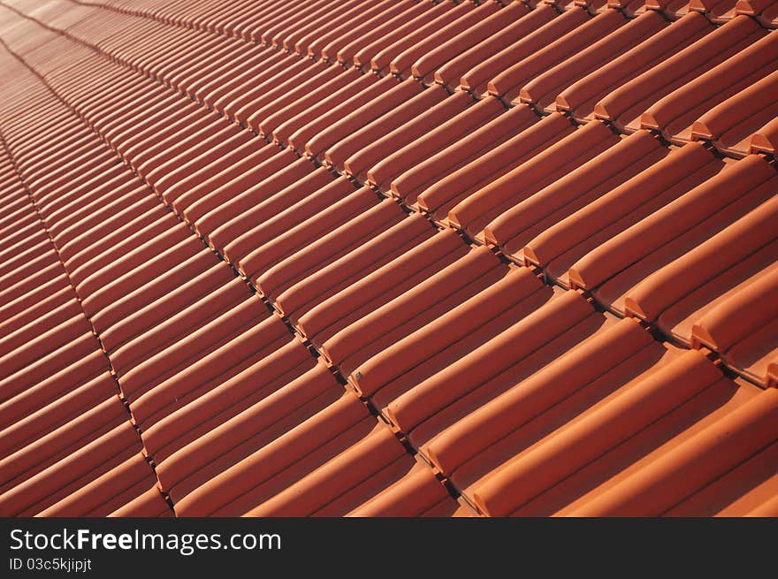 Skew view of a red roofing tile rooftop