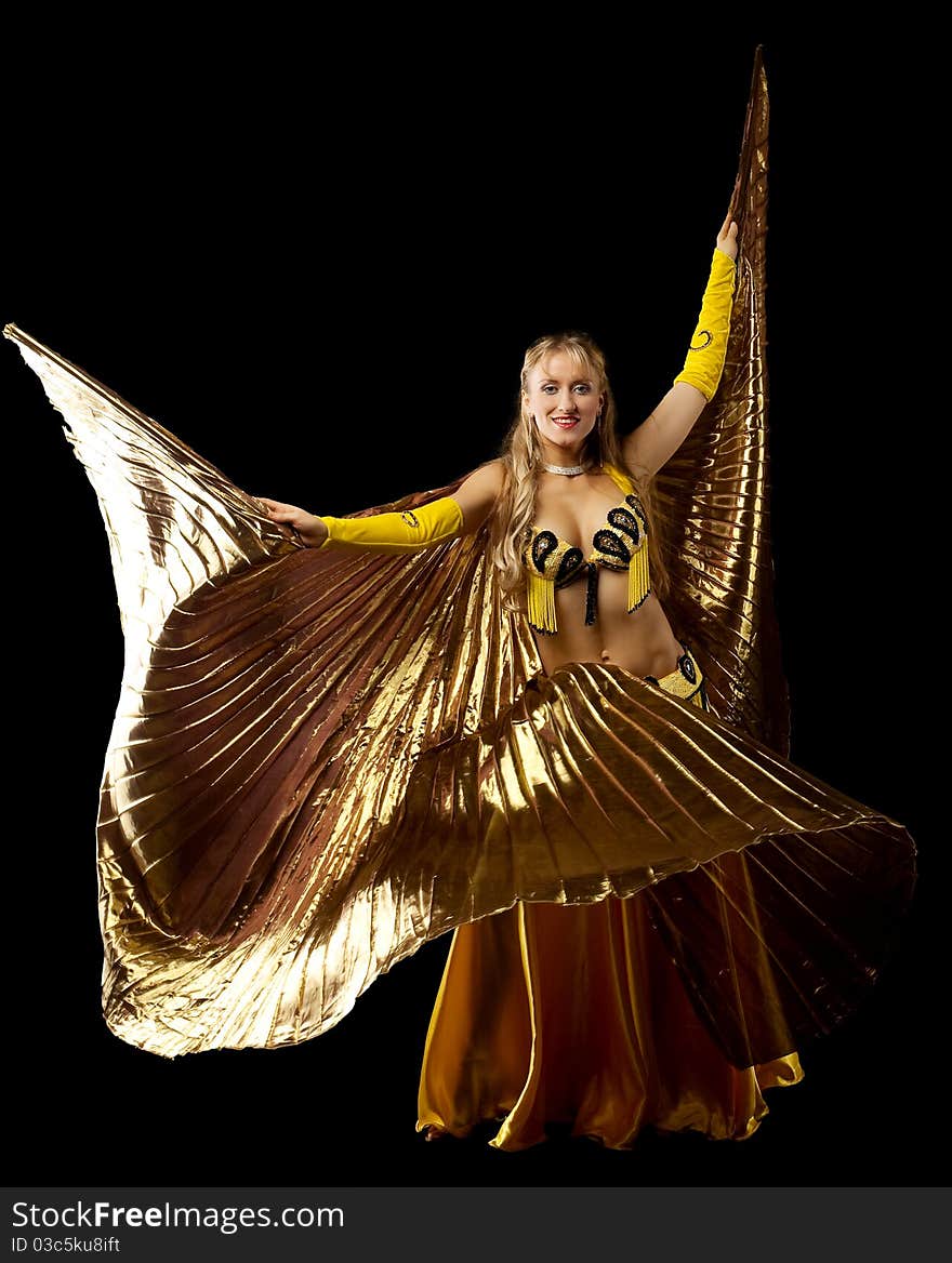 Beauty blond mature woman dance with gold wing arabian style. Beauty blond mature woman dance with gold wing arabian style