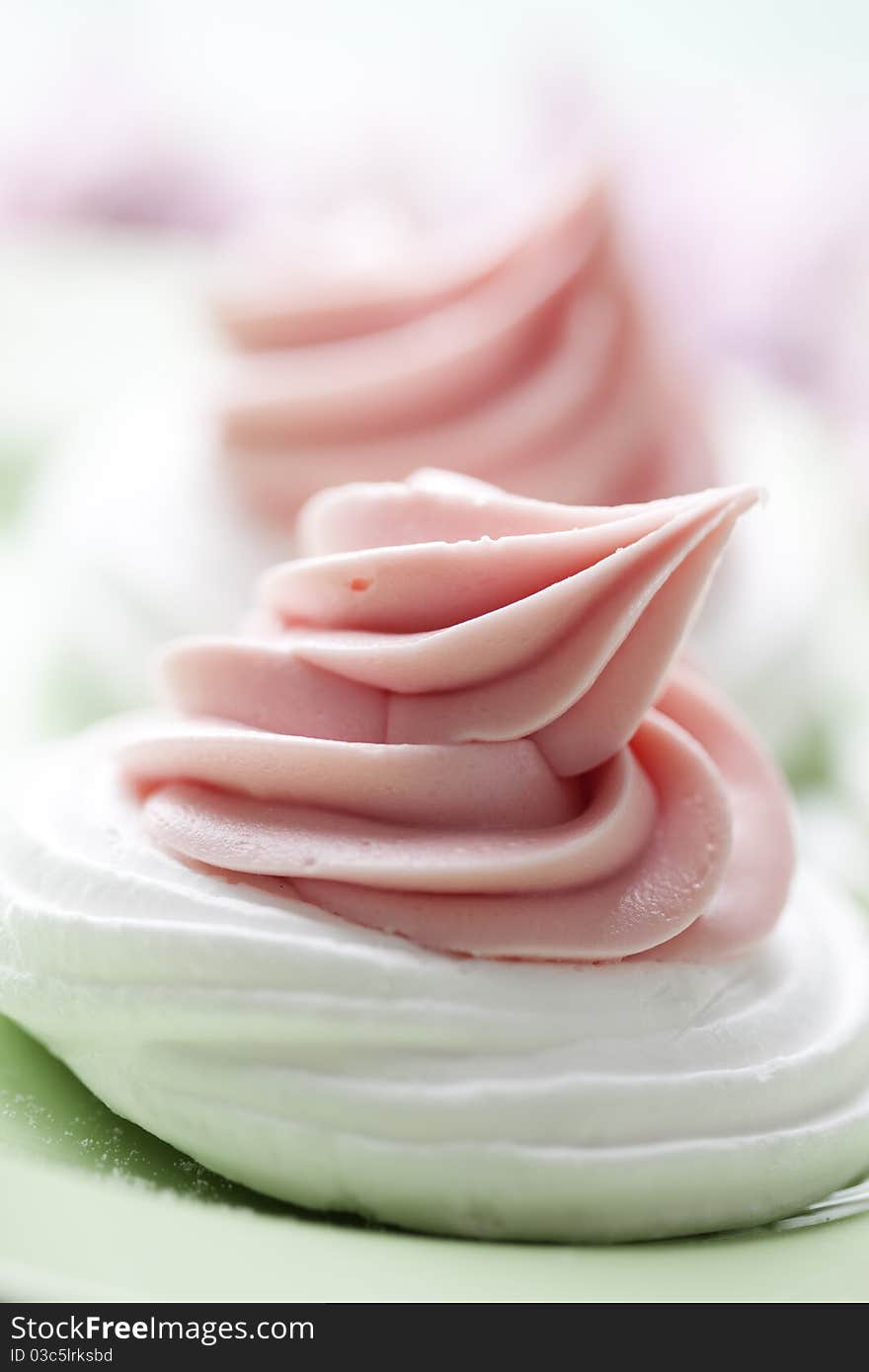 Meringue nests topped with strawberry cream. Meringue nests topped with strawberry cream