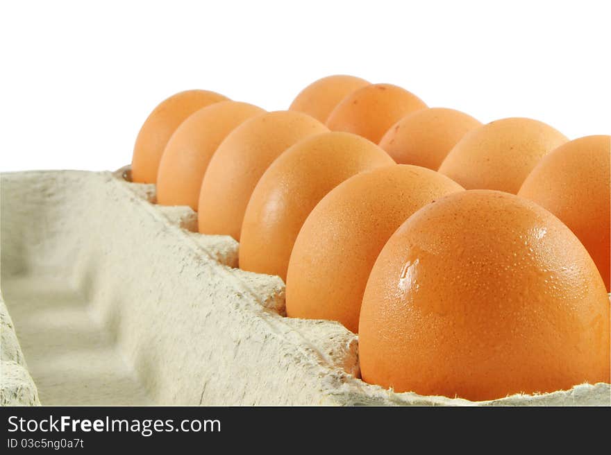 Package of fresh eggs isolated over white surface. Package of fresh eggs isolated over white surface